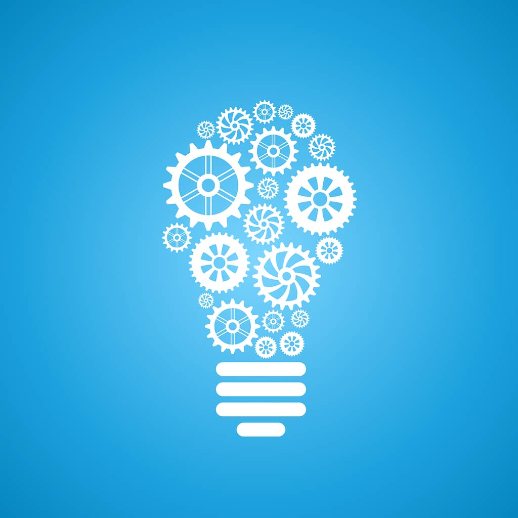 Illustration of a light bulb filled with gears and cogs, symbolizing innovation and creative thinking.