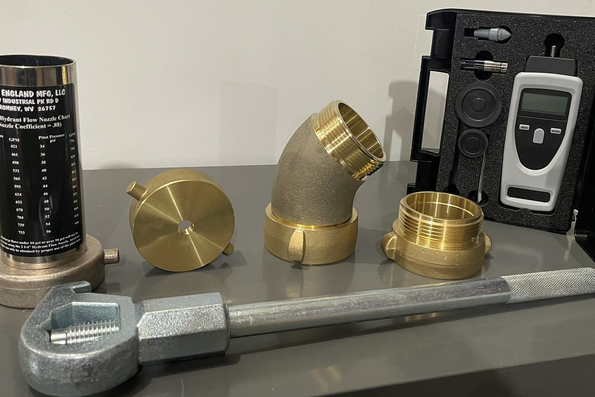 Brass flow accessories and tools displayed on a table.