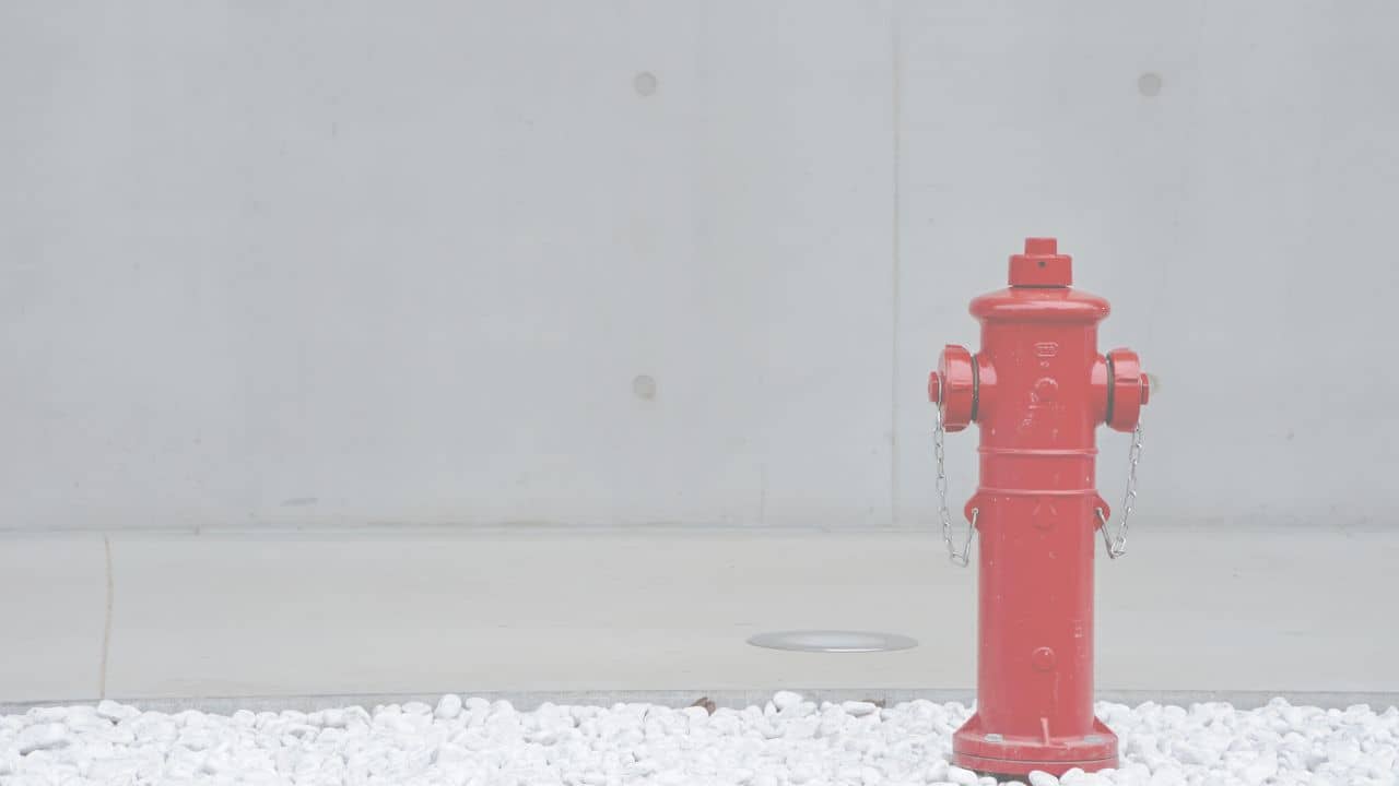 an image showcasing a single fire hydrant over a white background overlay.