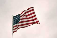 American flag waving against the sky